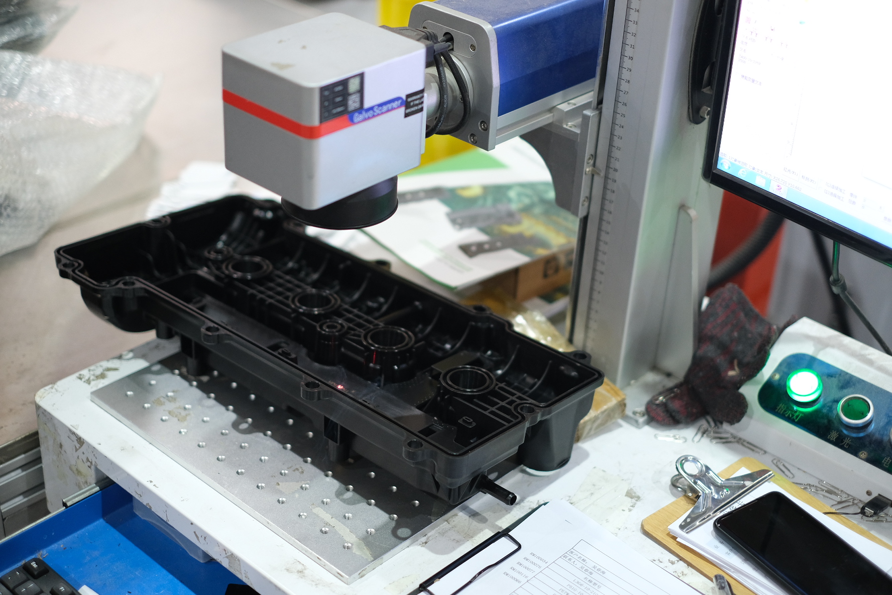 What is the function of the valve cover of the engine?